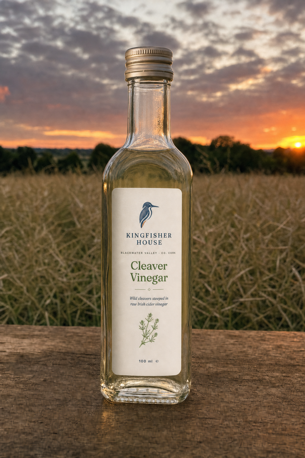 Cleaver Vinegar bottle over a field at sunset